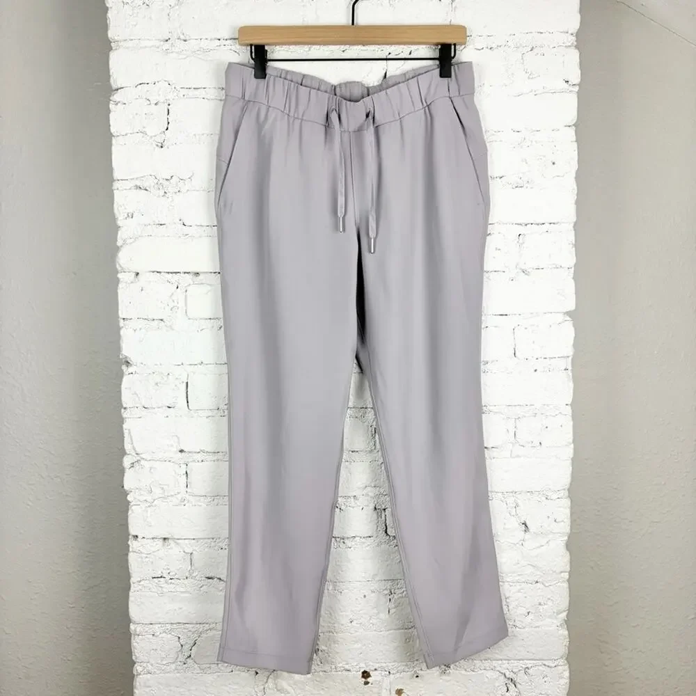 Lululemon On the Fly 7/8 Pants Woven Carbon Dust Tan Grey 8